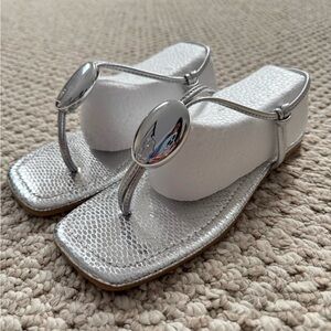 Silver Sandals with Thong Style and Decorative Ornament